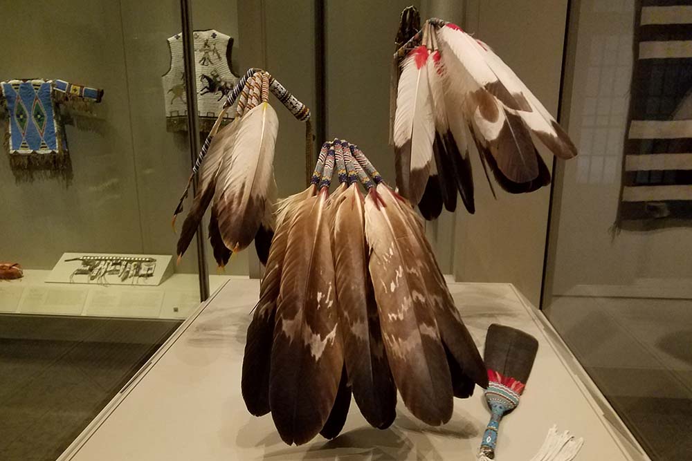 Eagle feather headdresses in museum display