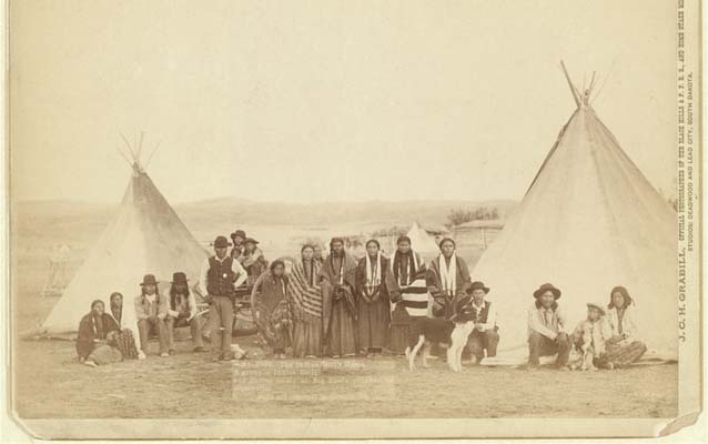 Historic photo of Native American group with teepees