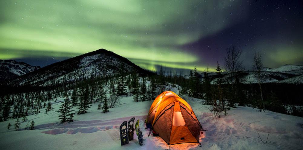 Tent camping under the aurora